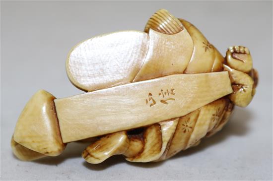 A Japanese ivory netsuke of a boy grinding seed?, Meiji period, 5.1cm